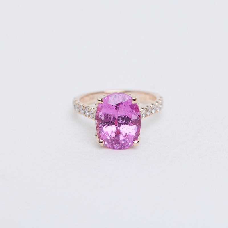 Pink oval sapphire Fleur ring with diamond set band in rose gold.