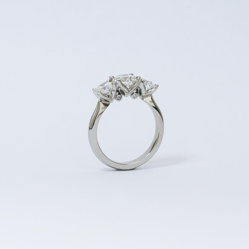 Charm 3 stone diamond ring.