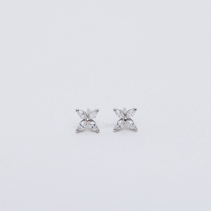 Small diamond flower stud earrings.