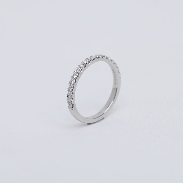 Round brilliant diamond band, split claw setting in platinum